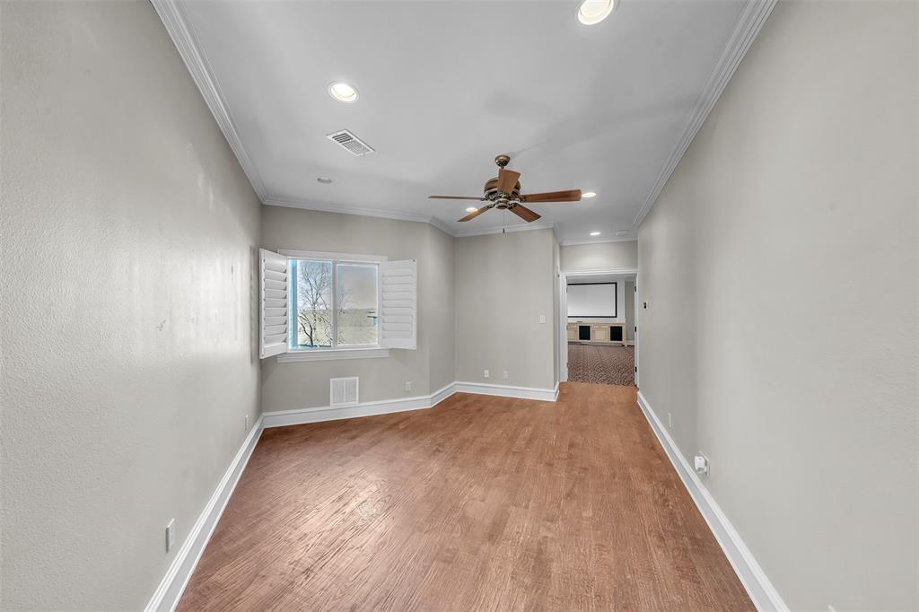 2909 Canyon Creek Drive Sherman, TX 75092 - Photo 29 of 40 a view of empty room with wooden floor and fan