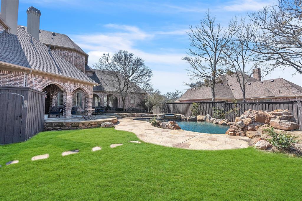 2909 Canyon Creek Drive Sherman, TX 75092 - Photo 36 of 40 a view of a house with swimming pool and sitting area