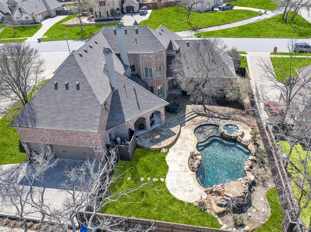 2909 Canyon Creek Drive Sherman, TX 75092 - Photo 5 of 40 an aerial view of a house with a yard and potted plants