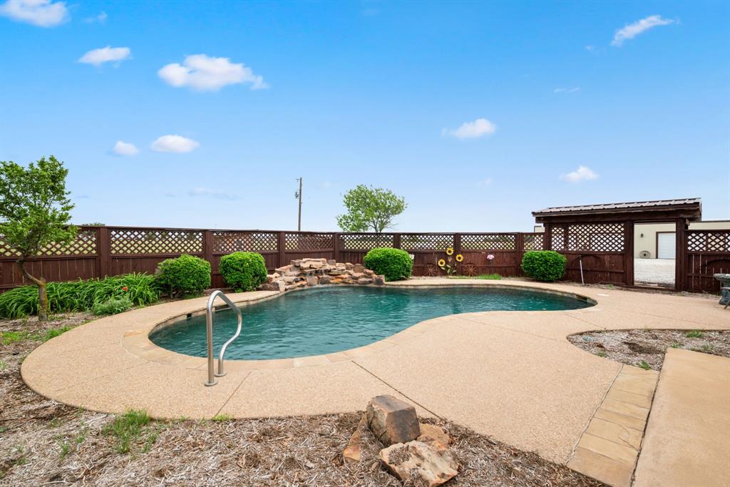 2752 South Branch Road Krum, TX 76249 - Photo 30 of 33 a view of a swimming pool with a patio