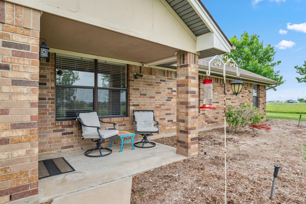 2752 South Branch Road Krum, TX 76249 - Photo 4 of 33 a bench sitting in front of house