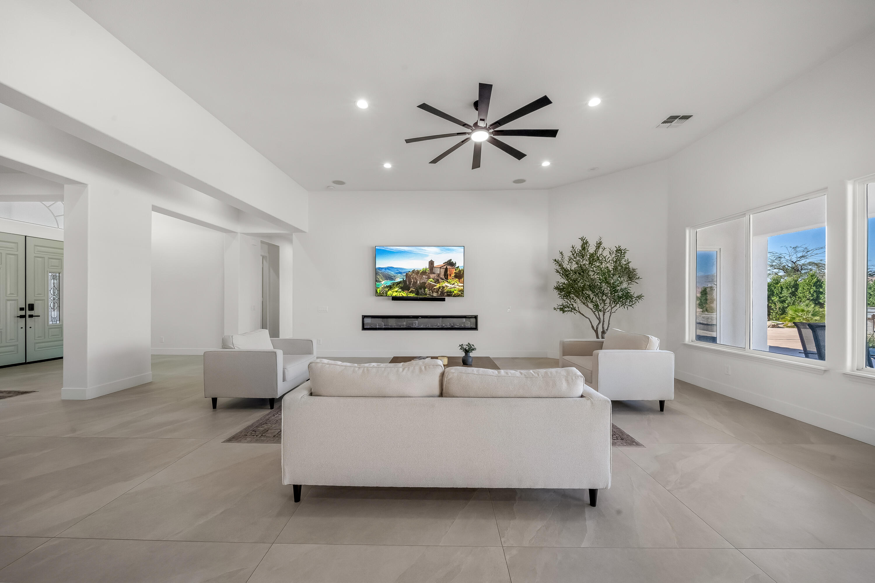 80262 Amazon Avenue Indio, CA 92201 - Photo 22 of 69 a living room with furniture and a large window