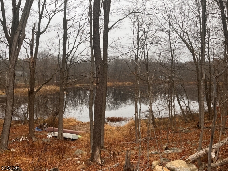 108 Highland Lakes Road Highland Lakes, NJ 07422 - Photo 15 of 21 a backyard of a house with lots of green space
