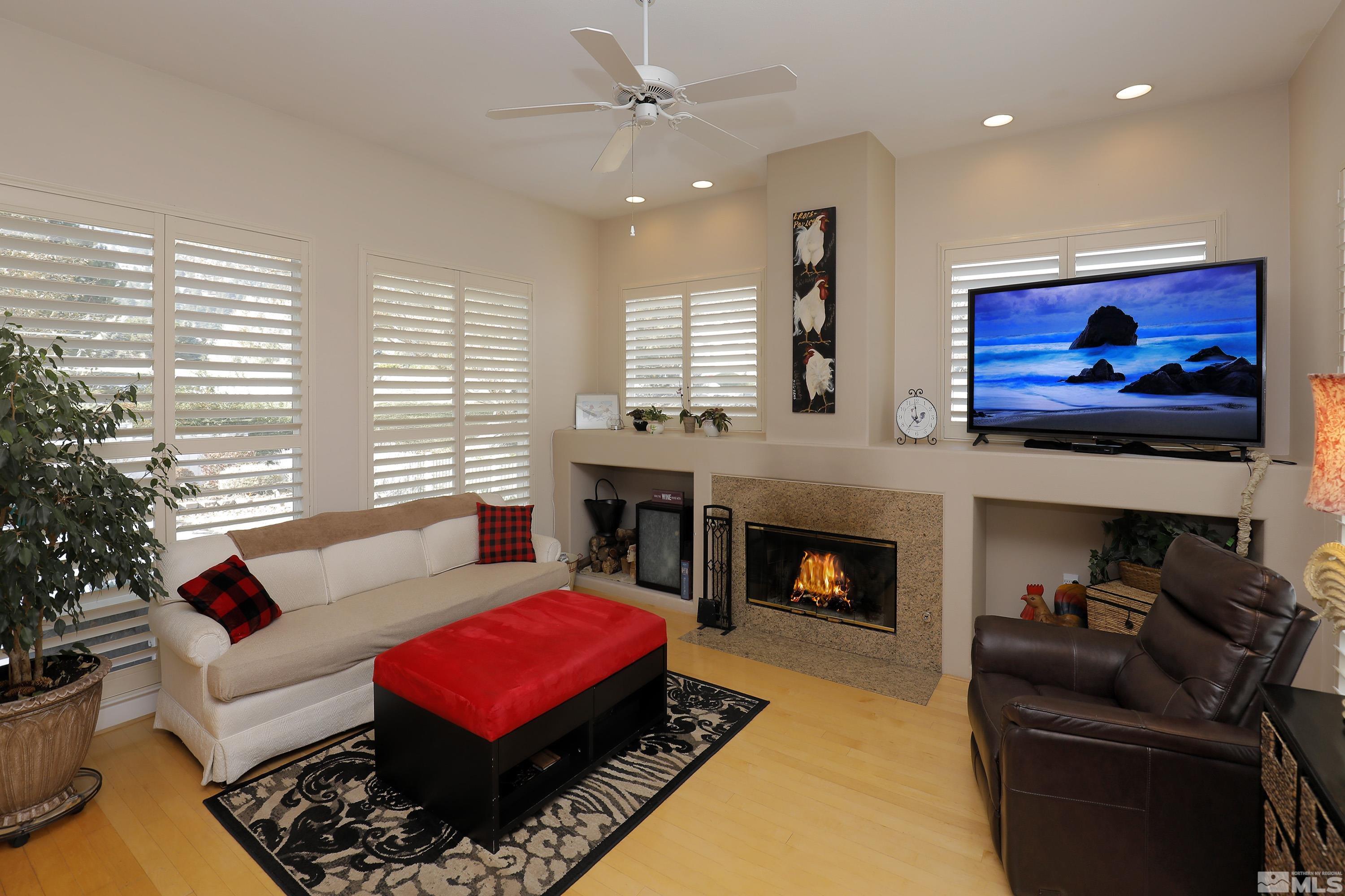 2461 Genoa Genoa, NV 89411 - Photo 13 of 35 a living room with furniture fireplace and window