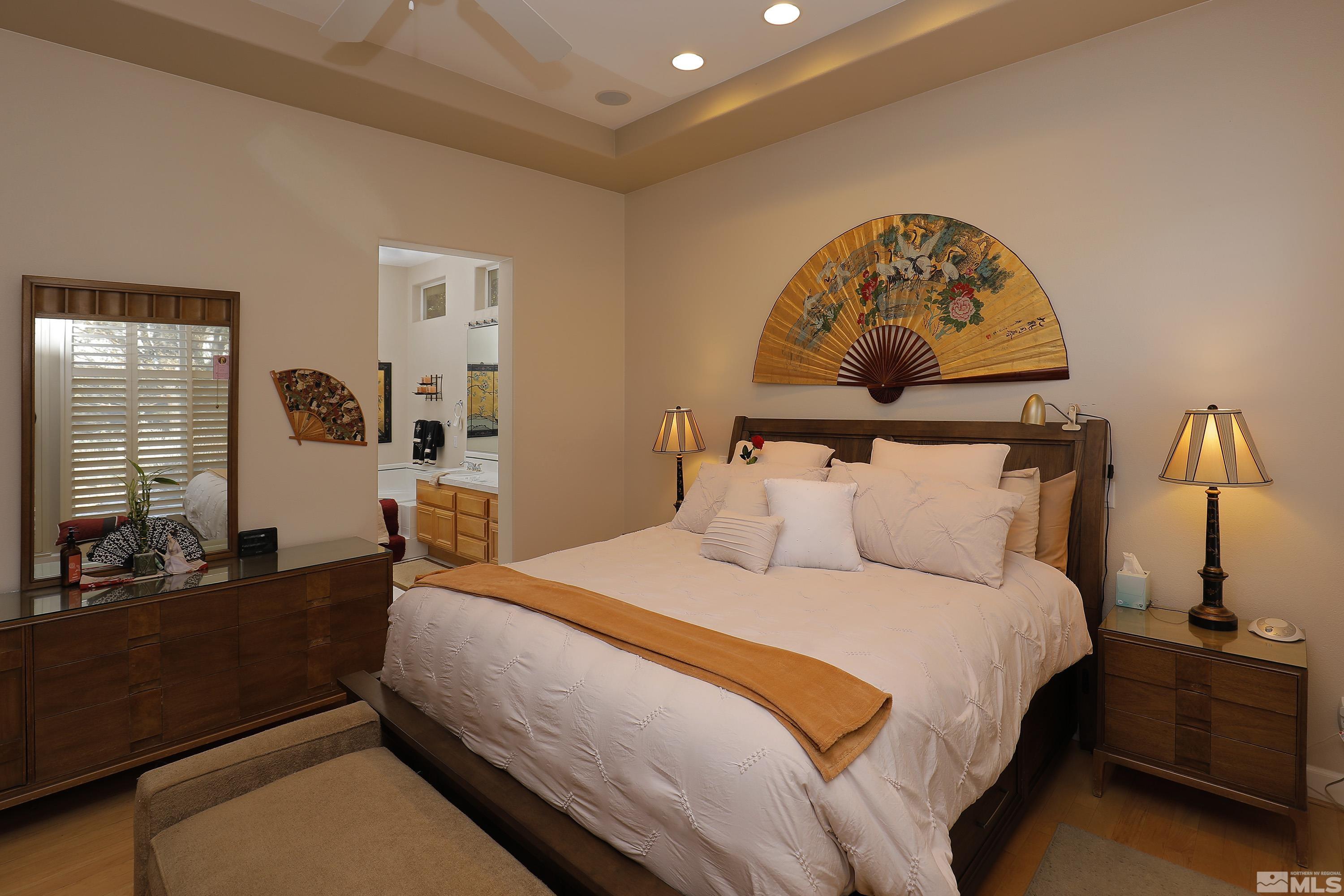 2461 Genoa Genoa, NV 89411 - Photo 18 of 35 a bed room with a bed and a painting on the wall