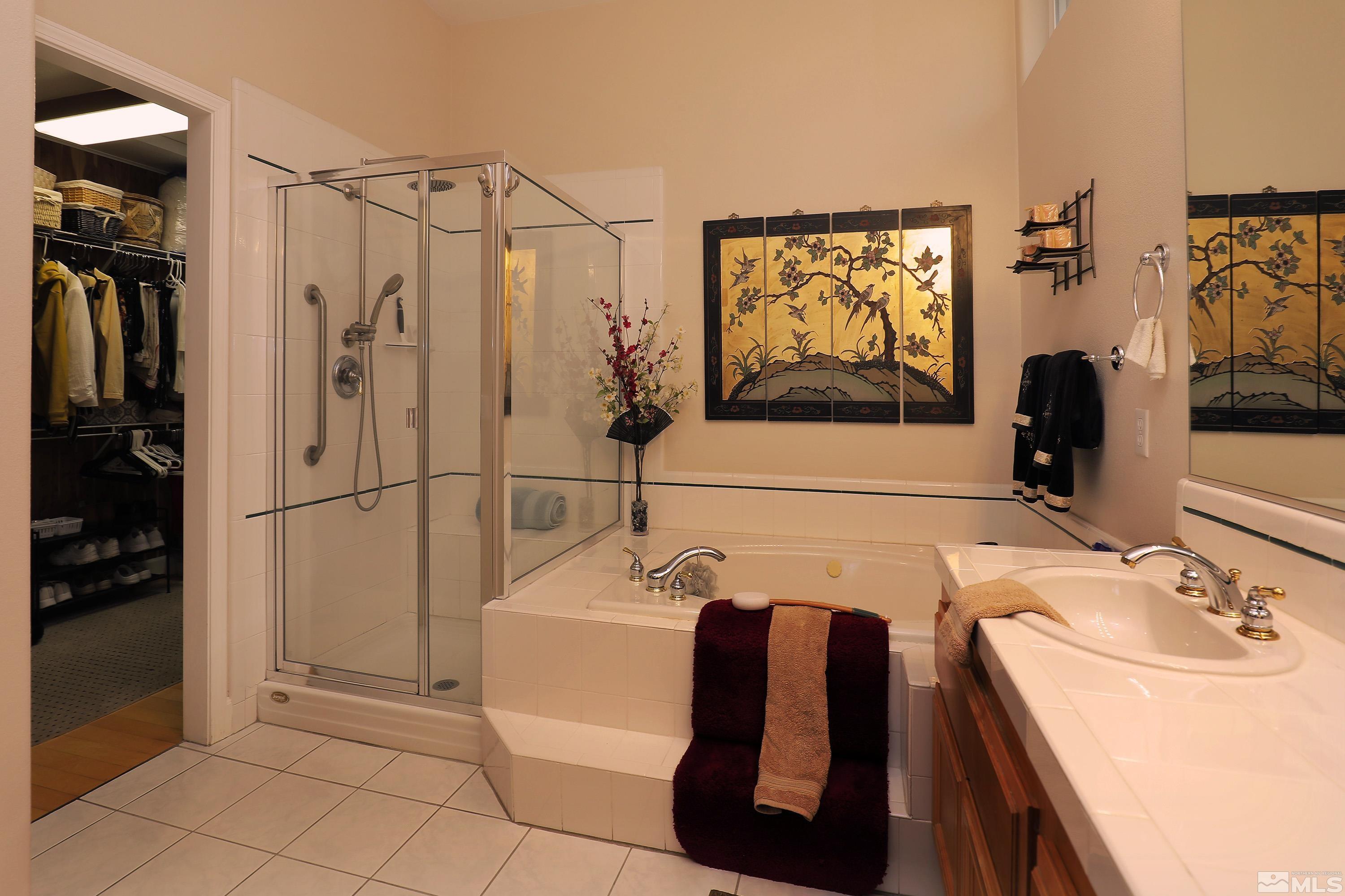 2461 Genoa Genoa, NV 89411 - Photo 20 of 35 a bathroom with a tub sink and mirror