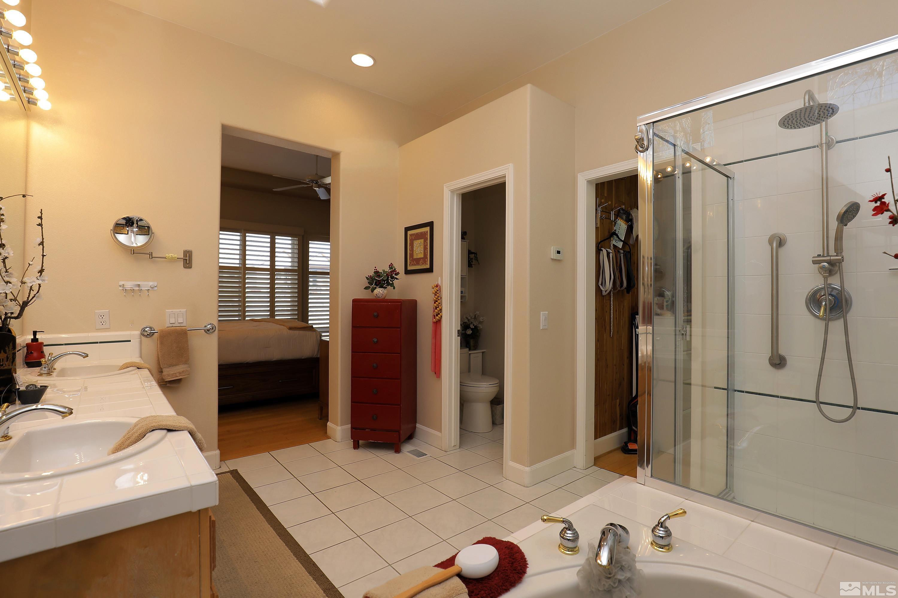 2461 Genoa Genoa, NV 89411 - Photo 22 of 35 a bathroom with a sink and a mirror
