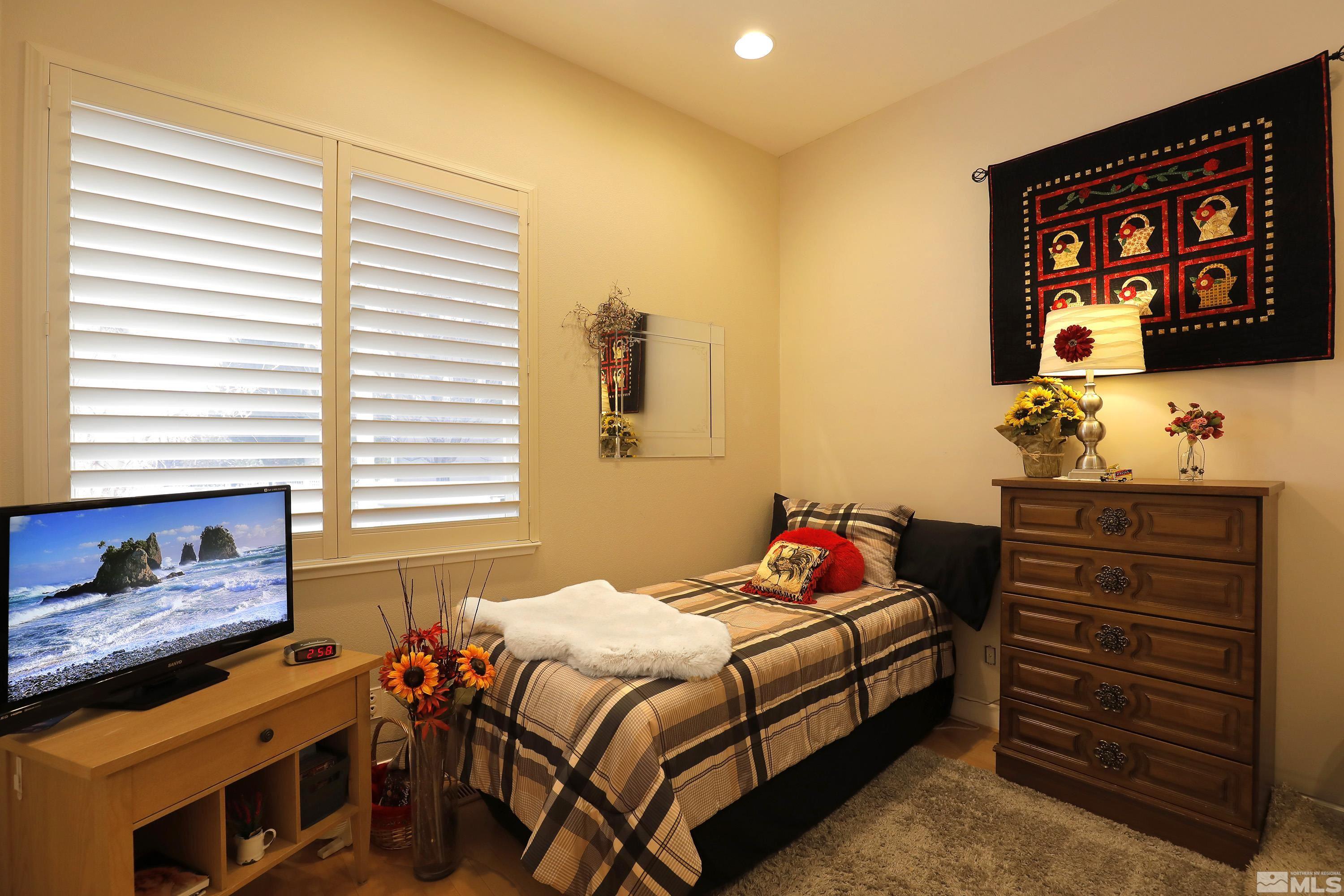 2461 Genoa Genoa, NV 89411 - Photo 24 of 35 a bedroom with a bed and a window