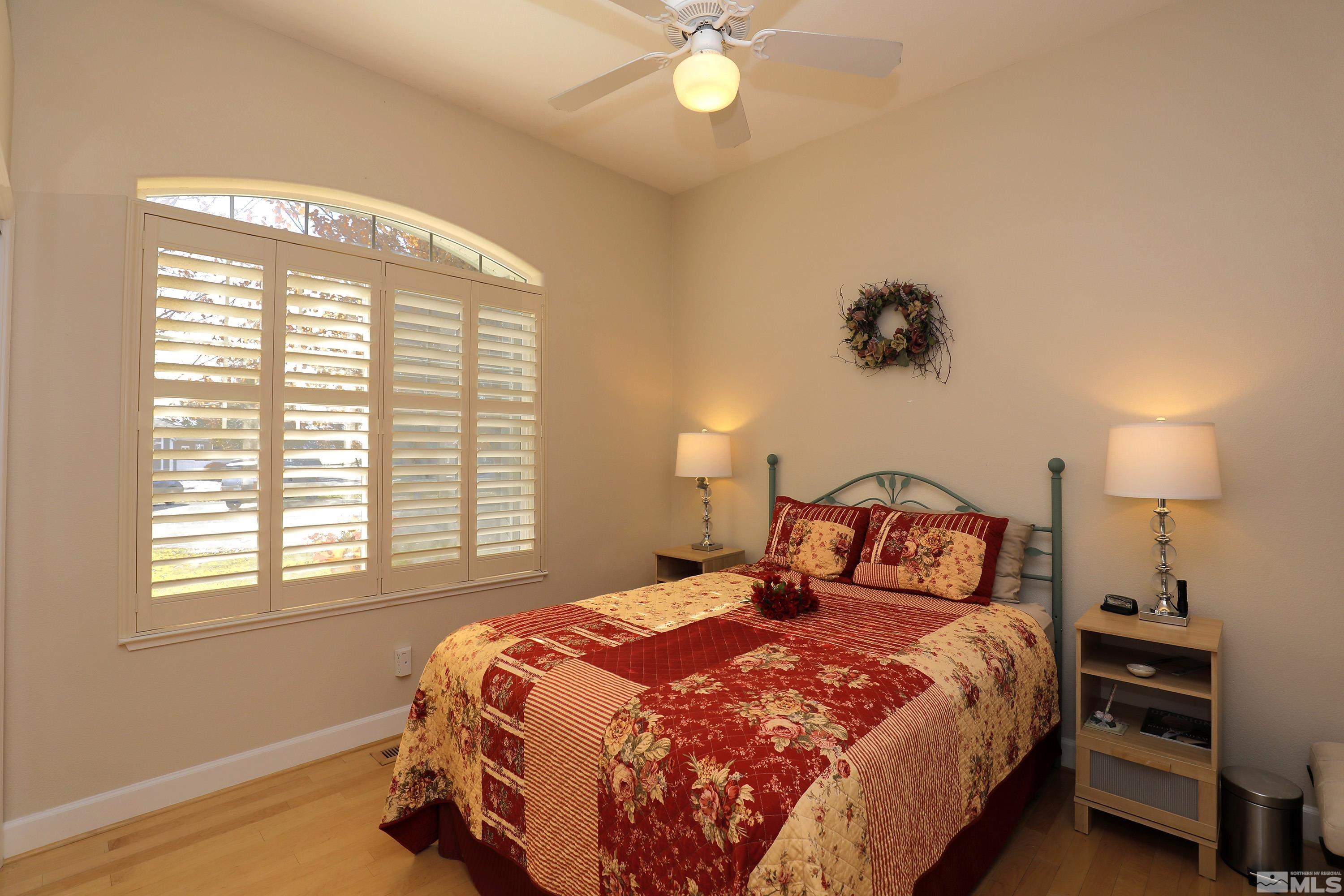 2461 Genoa Genoa, NV 89411 - Photo 27 of 35 a bedroom with a bed and a chandelier