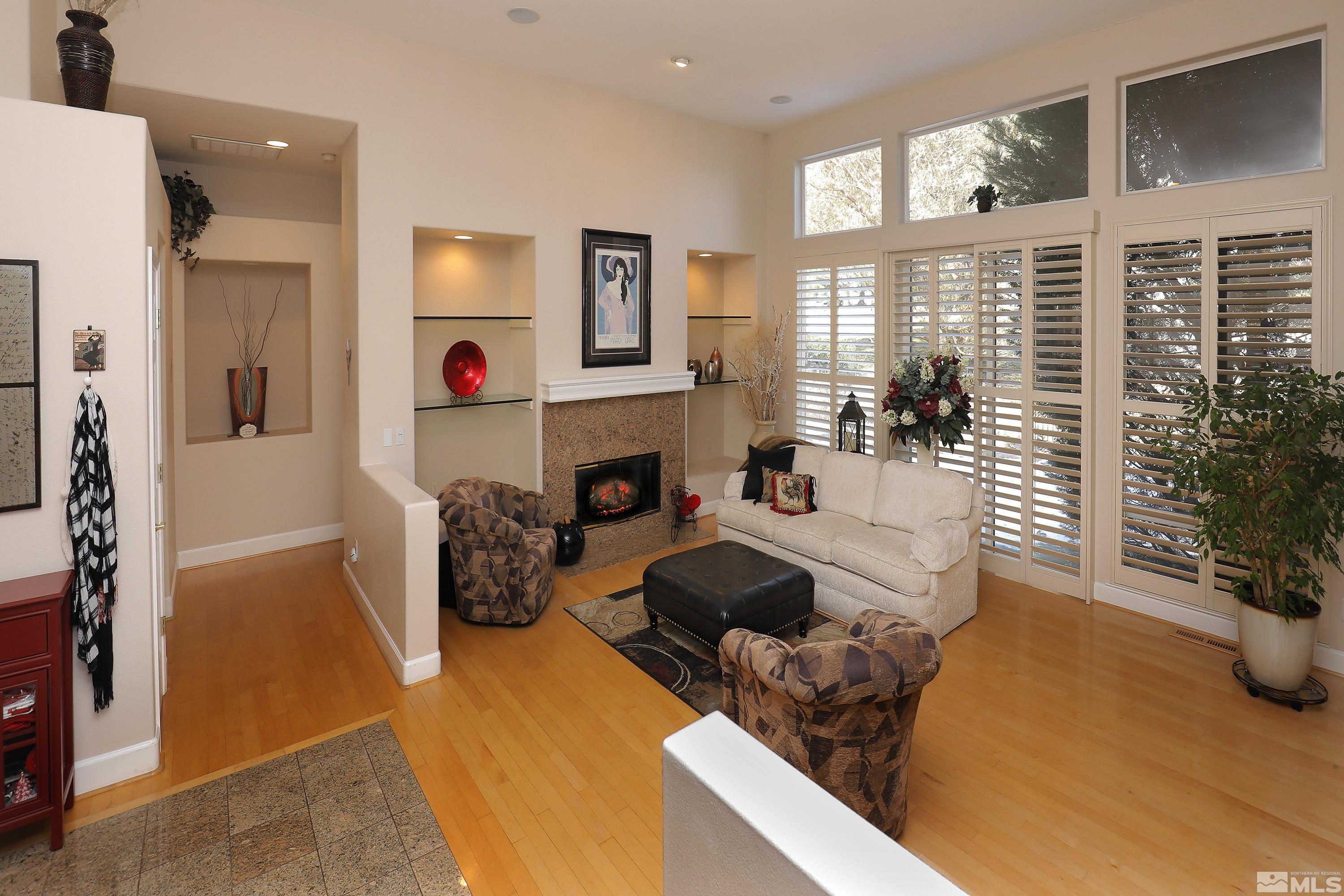 2461 Genoa Genoa, NV 89411 - Photo 7 of 35 a living room with furniture and a fireplace