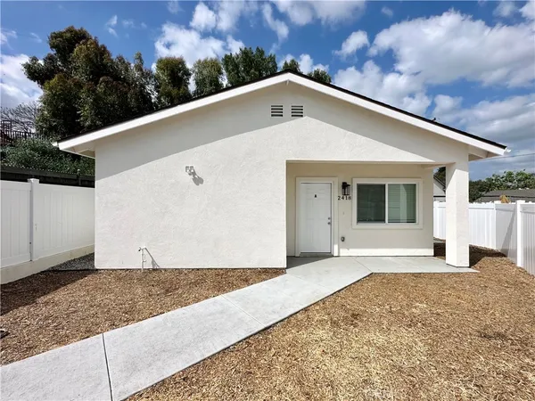 a front view of a house with a garage