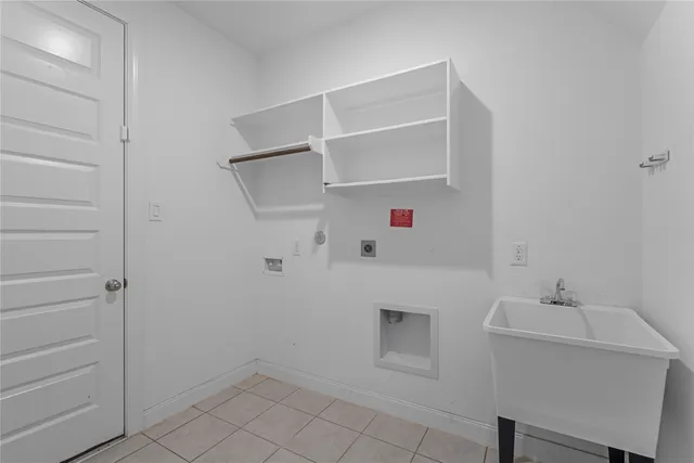 a view of empty room with window and ceiling fan