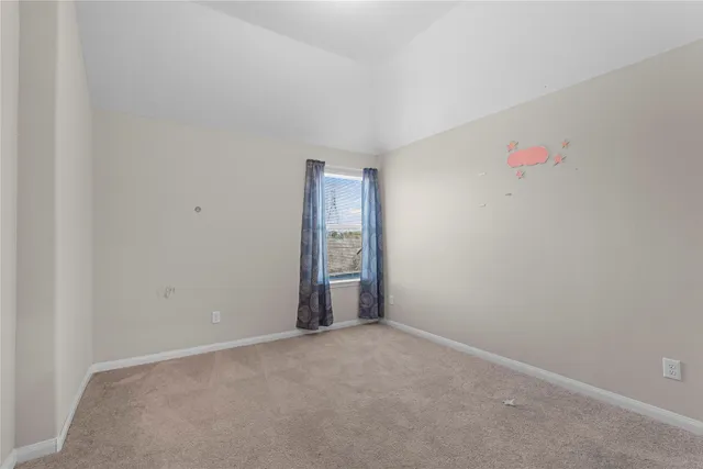 an empty room with closet area