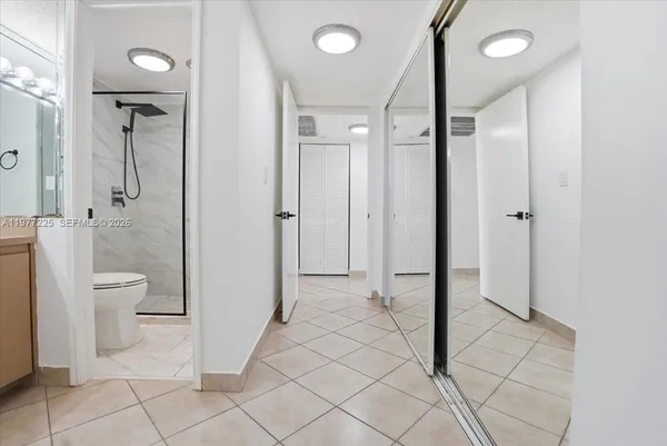 a bathroom with a shower and a toilet