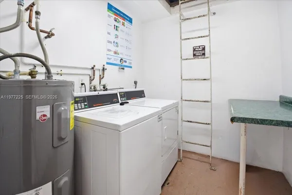 a utility room with washer and dryer