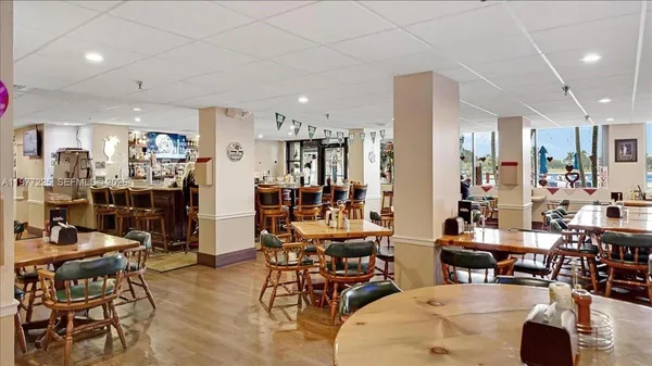 a living room with lots of furniture and white walls
