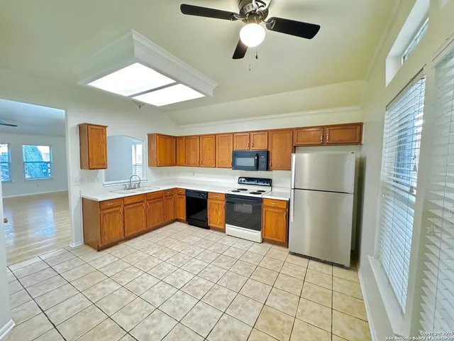 a kitchen with stainless steel appliances a refrigerator and a sink
