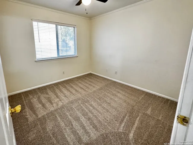 a view of a livingroom with a ceiling fan