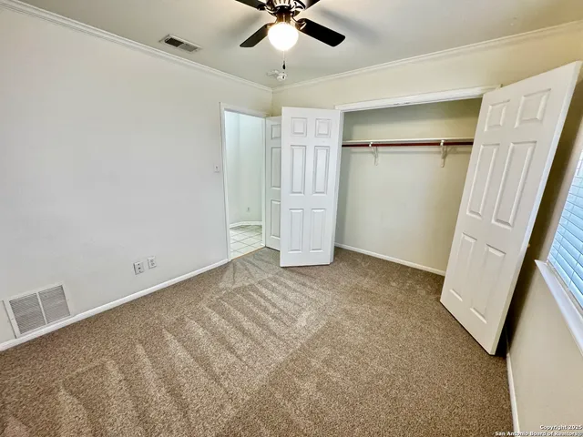 a bathroom with a double vanity sink toilet mirror and shower