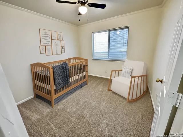 wooden floor in an empty room with a bathroom