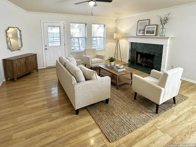 a living room with furniture and a fireplace
