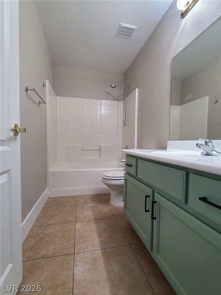 2278 Chestnut Ranch Avenue Henderson, NV 89052 - Photo 13 of 18 A well-appointed bathroom features a modern vanity and practical shower-over-tub design.