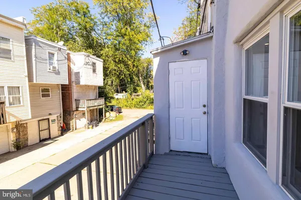 a view of a balcony with wooden floor