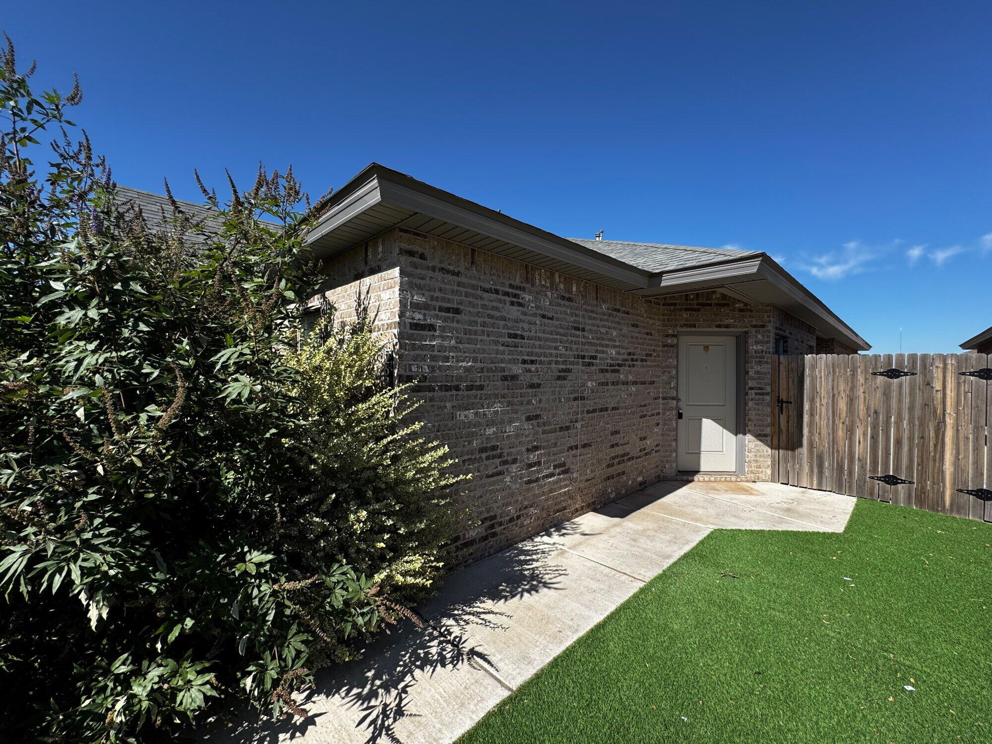 2620 135th Street Lubbock, TX 79423 - Photo 1 of 13 a backyard of a house with lots of green space