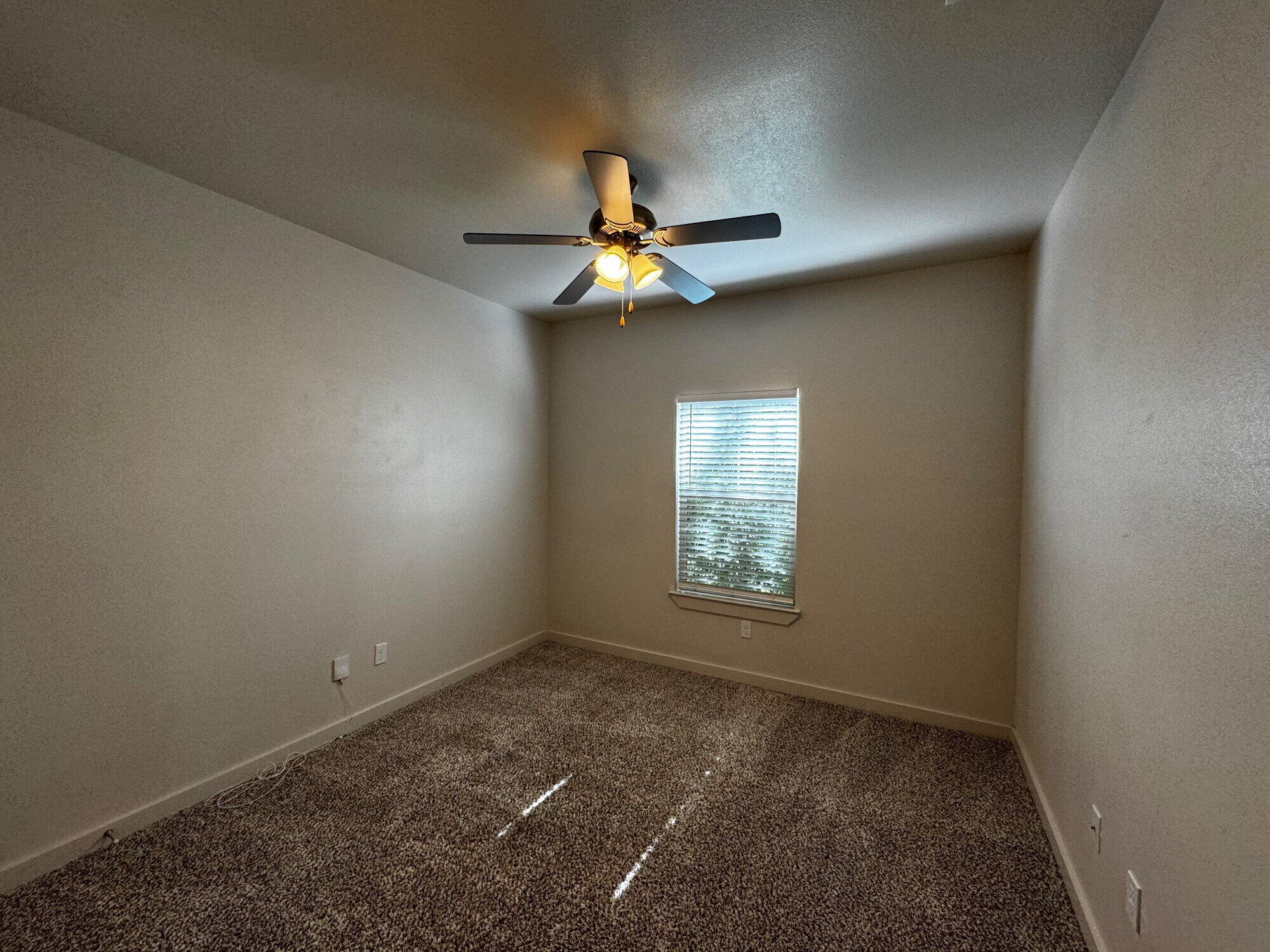 2620 135th Street Lubbock, TX 79423 - Photo 11 of 13 a view of an empty room with a window
