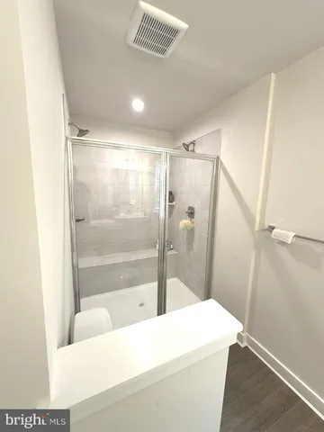 a view of a living room with furniture and a window