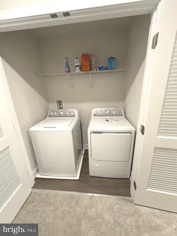 a spacious bedroom with a bed and a window