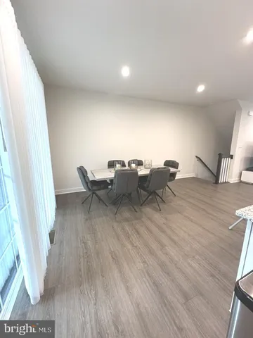 a view of an empty room with a fireplace