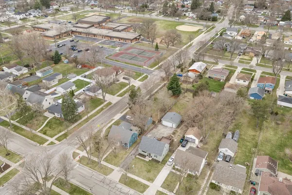 an aerial view of residential houses with outdoor space