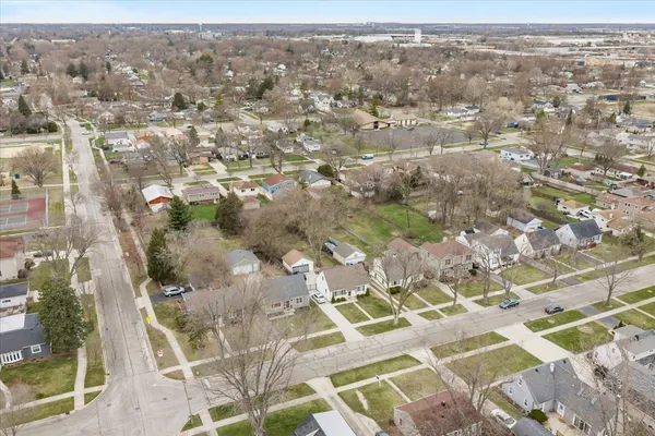 an aerial view of residential houses with outdoor space
