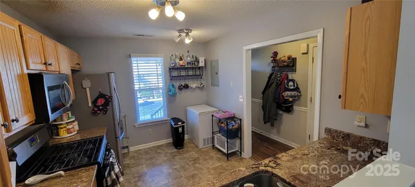 a bedroom with a bed and a mirror
