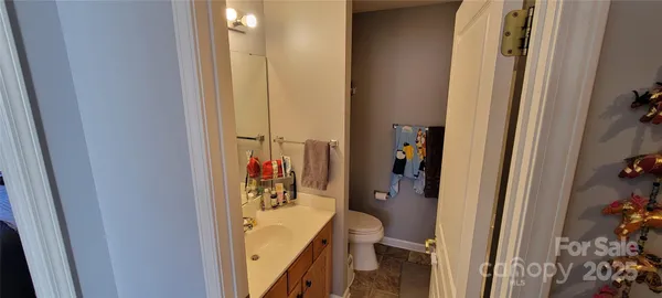 a view of a bathroom from a hallway