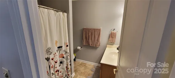 a bathroom with a shower and a tub