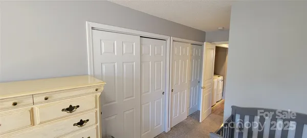 a view of a utility room with closet