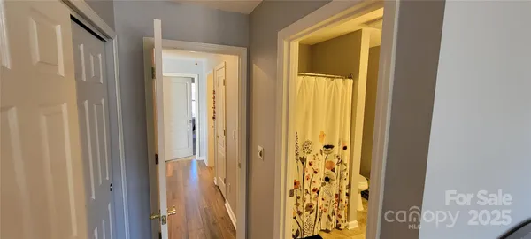 a view of a bathroom from a hallway