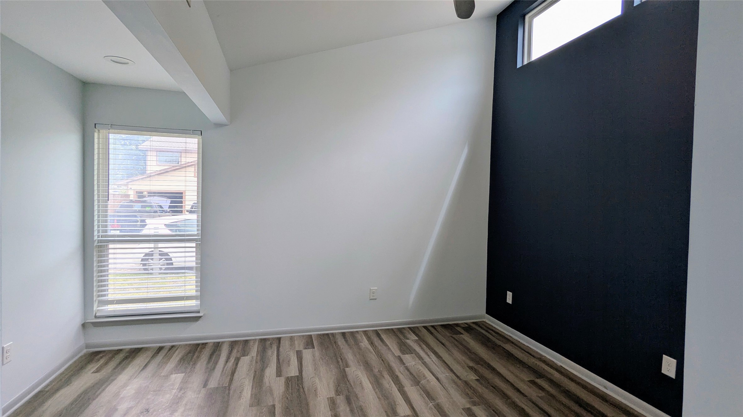 4505 Teri Road, Unit A Austin, TX 78744 - Photo 10 of 23 A well-lit bedroom with soaring ceilings and durable flooring.
