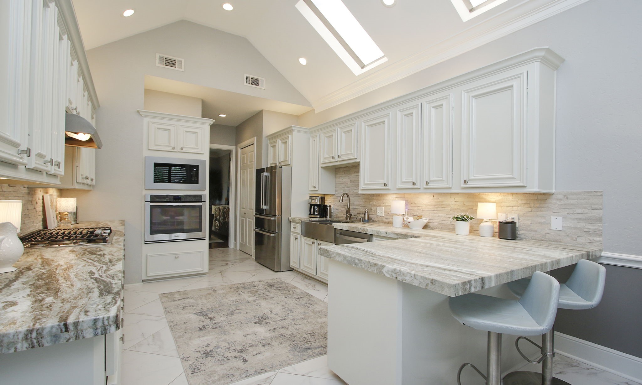 16610 Manningtree Lane Spring, TX 77379 - Photo 25 of 50 The lighting in the kitchen is new and includes lighting above and beneath the upper cabinets.