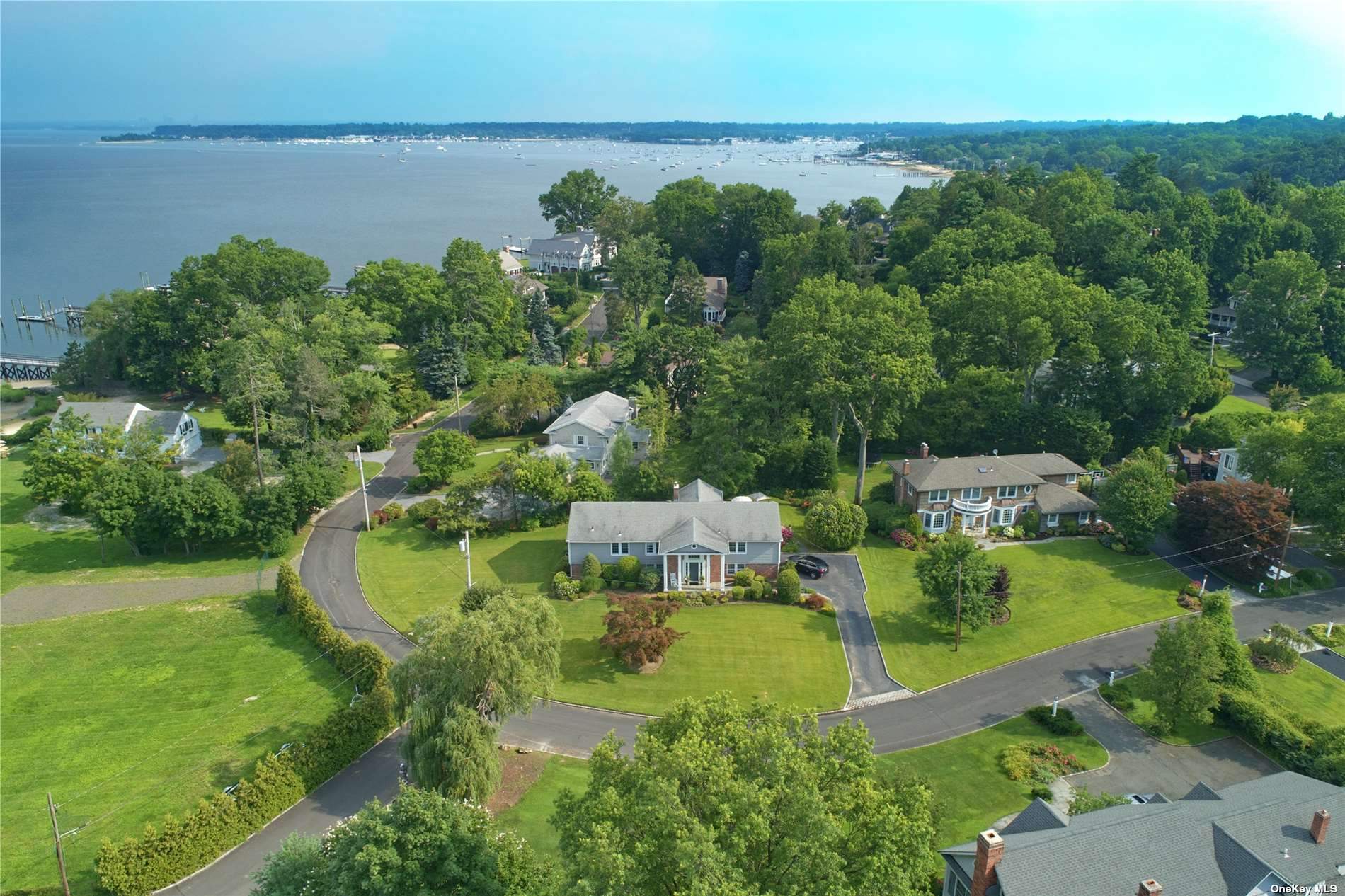 an aerial view of a house with lake view