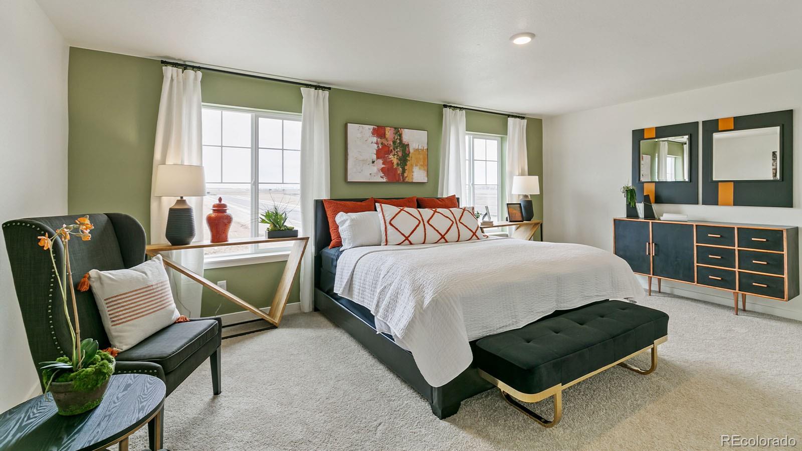 801 South Apex Avenue Fort Lupton, CO 80621 - Photo 18 of 26 a bedroom with a bed a table and chair