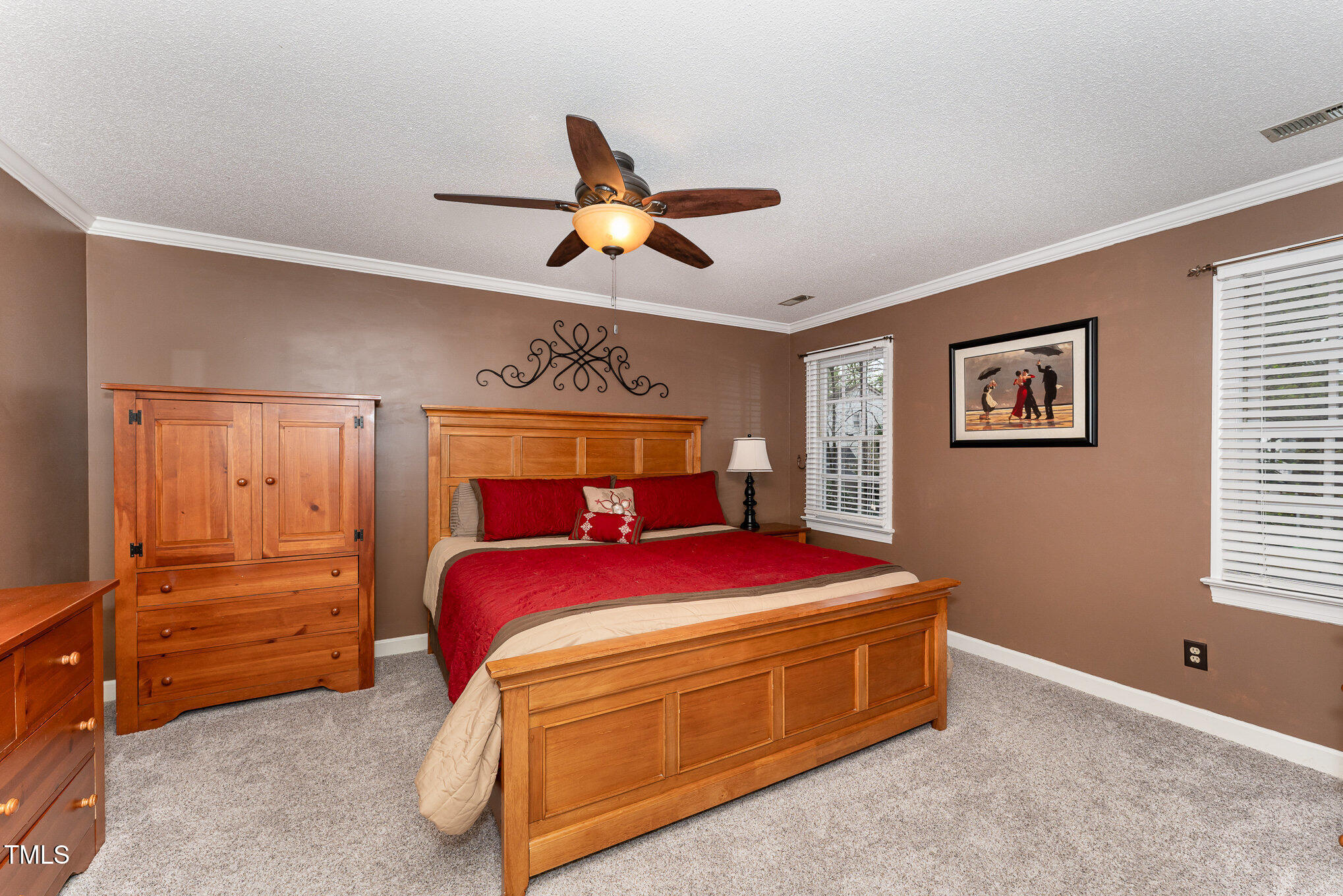 4217 Pike Road Raleigh, NC 27613 - Photo 11 of 22 a bedroom with a bed and a ceiling fan