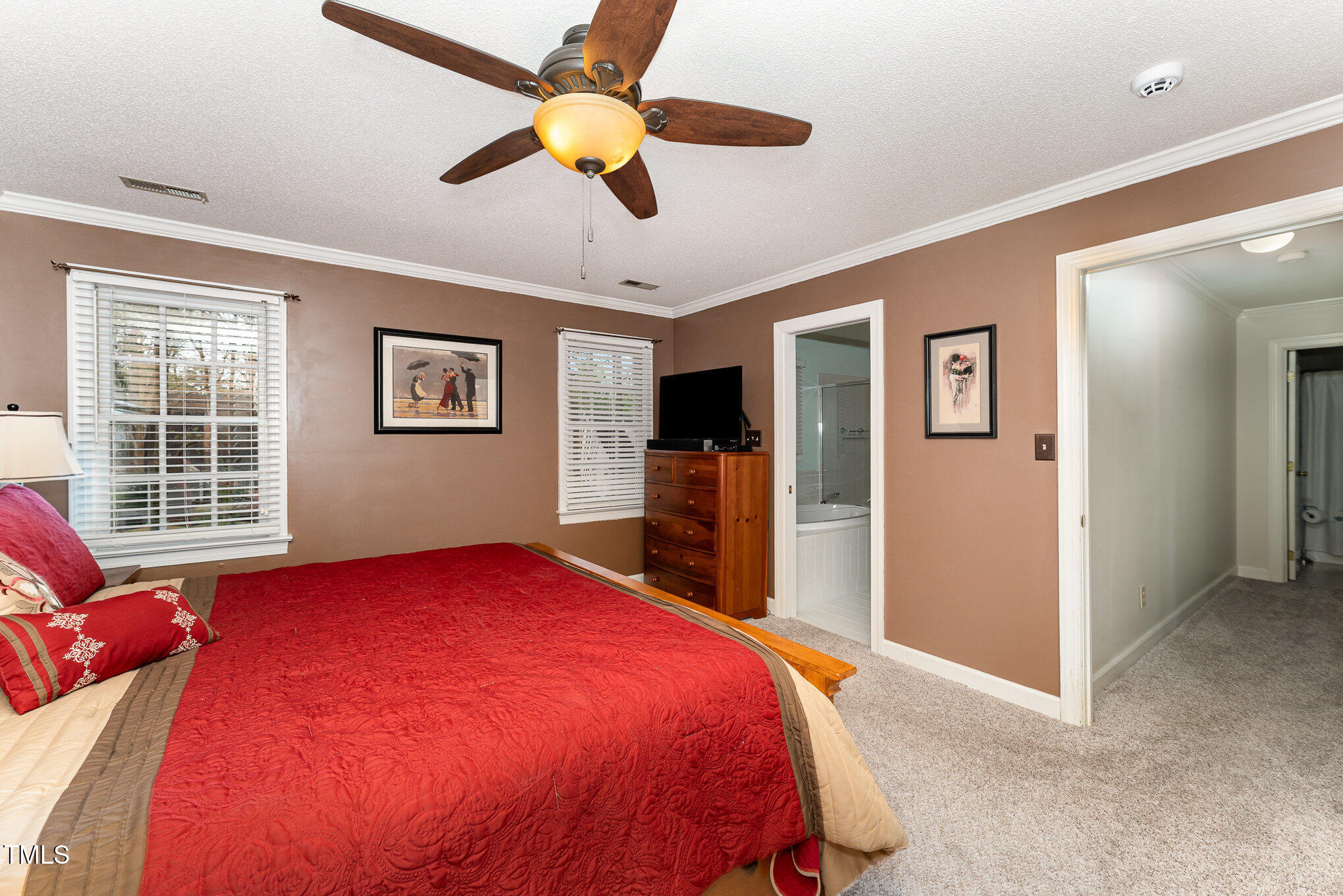 4217 Pike Road Raleigh, NC 27613 - Photo 12 of 22 a bed room with a bed and a television