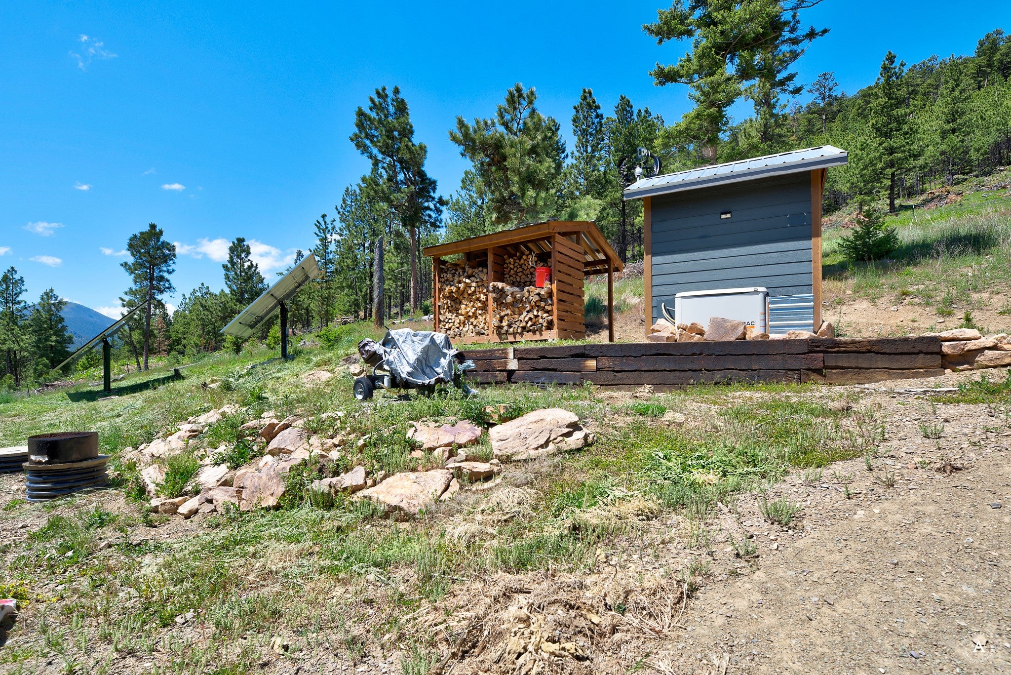 2848 Allen Gulch Road Wolf Creek, MT 59648 - Photo 44 of 68 Wood Shed and Generator/Solar Shed