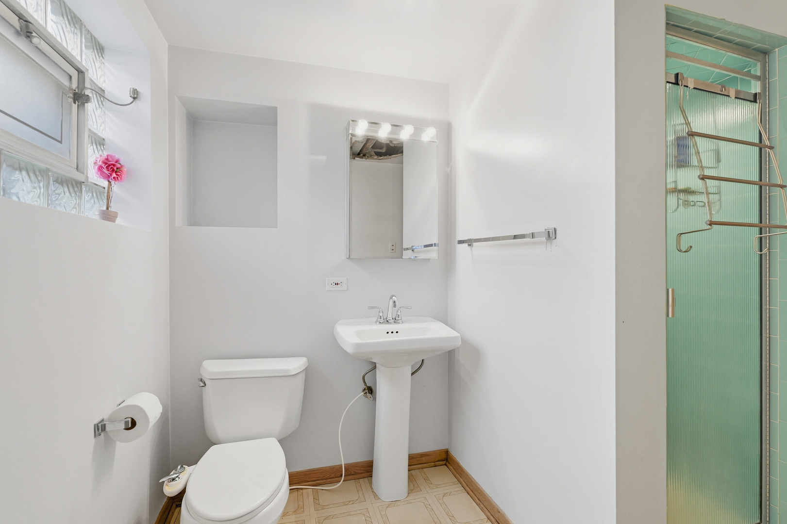 9020 South Constance Avenue Chicago, IL 60617 - Photo 12 of 26 a bathroom with a sink toilet and a mirror