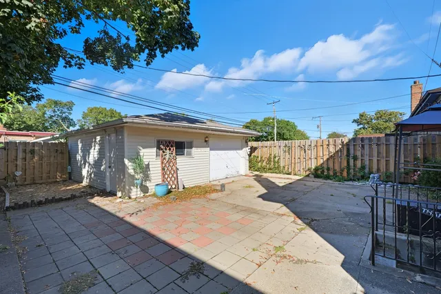 a view of a backyard with sitting area