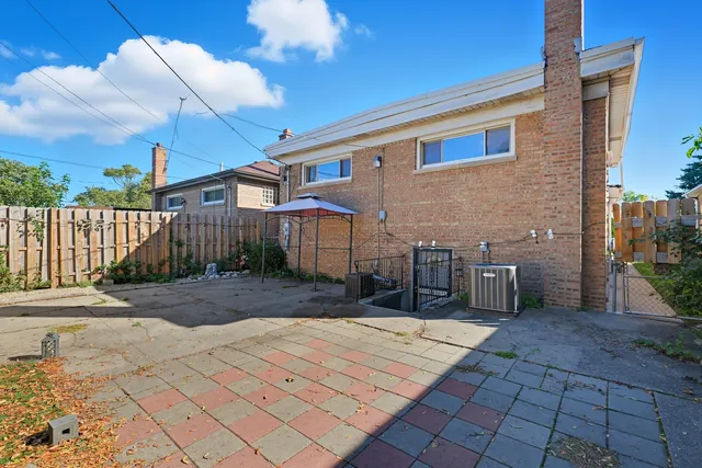 a view of a patio with a table and chairs