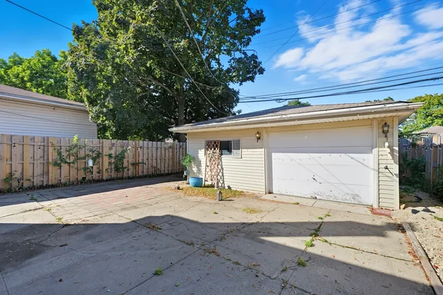 a backyard of a house with shaded area